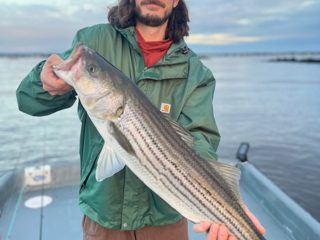 Josh with striped bass